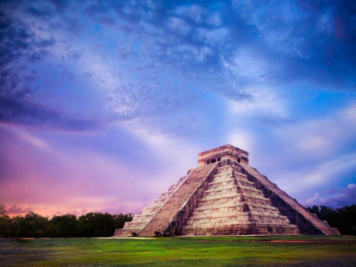 Check out the best Cancun day trips recommended by top family travel blog Marcie in Mommyland. Image of Temple of Kukulkan, pyramid in Chichen Itza, Yucatan, Mexico