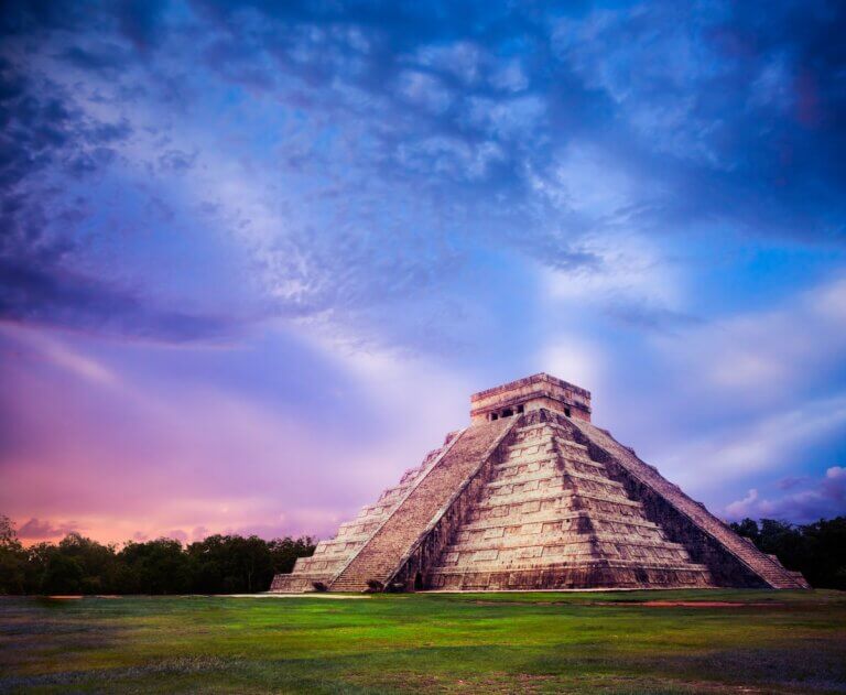 Check out the best Cancun day trips recommended by top family travel blog Marcie in Mommyland. Image of Temple of Kukulkan, pyramid in Chichen Itza, Yucatan, Mexico