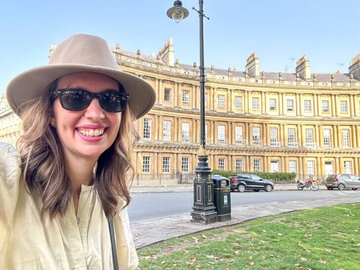 Find out the best cheap and free things to do in Bath England recommended by top family travel blog Marcie in Mommyland. Image of a woman in front of the Circus in Bath, England