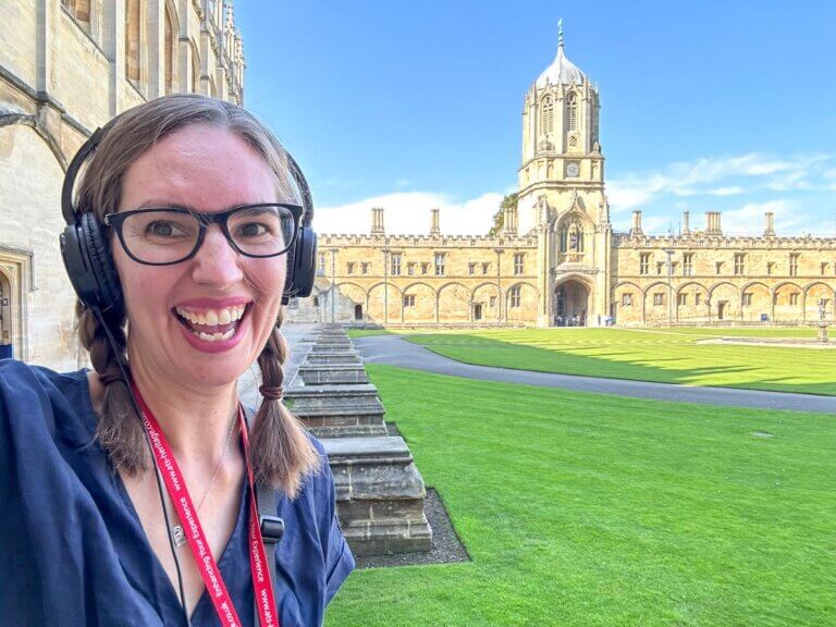 Find out the best cheap and free things to do in Oxford England by top family travel blog Marcie in Mommyland. Image of a woman at Oxford University