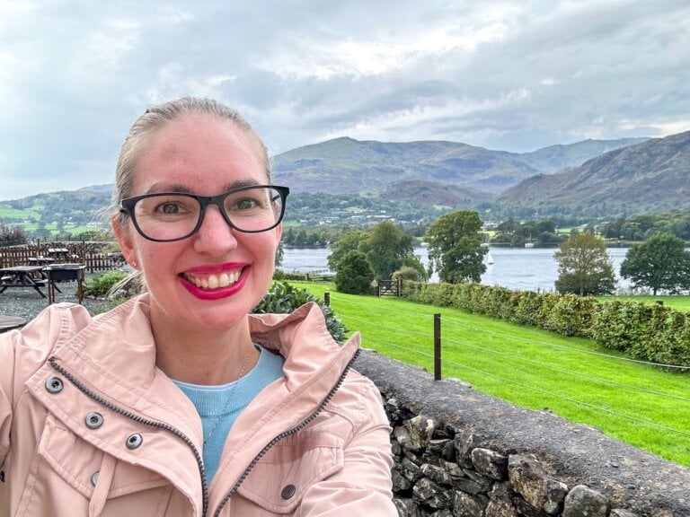 Find out the best things to do in the Lake District in England for families. Image of a woman in front of a lake in England