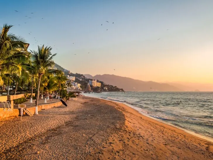 Check out these 12 day trips from Puerto Vallarta recommended by top family travel blog Marcie in Mommyland. Image of a Puerto Vallarta sunset