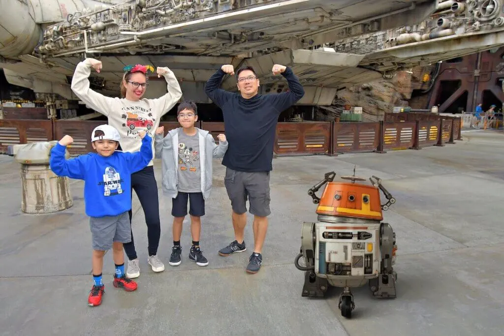 Find out the best Disney vacation destinations recommended by top family travel blog Marcie in Mommyland. Image of Marcie Cheung and her family at Star Wars Galaxy's Edge at Disneyland