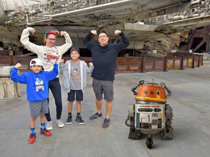 Find out the best Disney vacation destinations recommended by top family travel blog Marcie in Mommyland. Image of Marcie Cheung and her family at Star Wars Galaxy's Edge at Disneyland