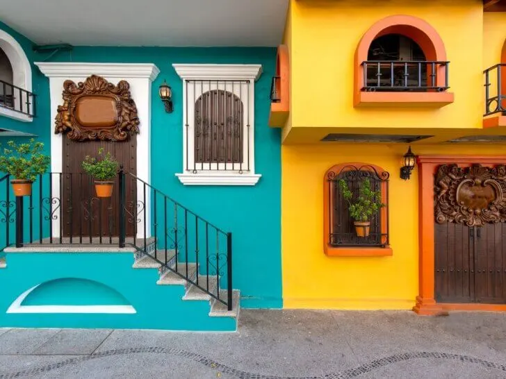 Check out this list of things to do in Puerto Vallarta with kids recommended by top family travel blog Marcie in Mommyland. Image of Puerto Vallarta colorful streets in historic city center near the sea promenade (Malecon) and Playa de los Muertos beach.