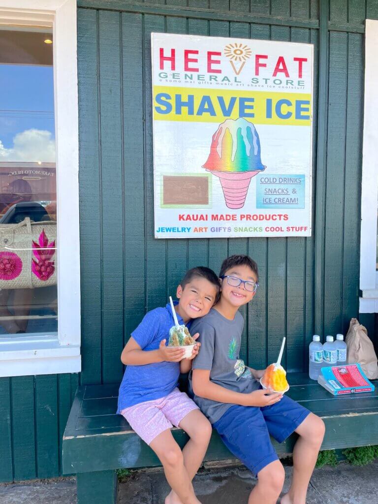 Image of two boys in front of Hee Fat General Store Shave Ice on Kauai. Photo credit: Marcie Cheung of Marcie in Mommyland