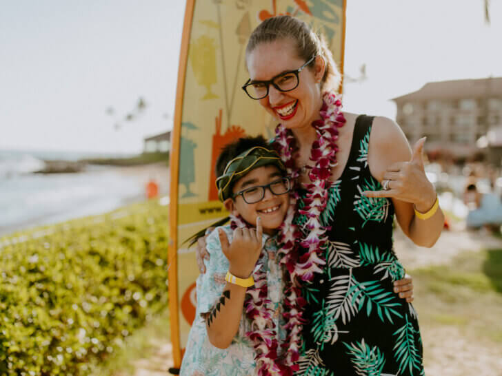 Check out these Kauai travel tips by top family travel blog Marcie in Mommyland. Image of Marcie Cheung and her son on Kauai.