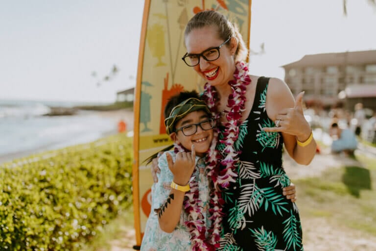 Check out these Kauai travel tips by top family travel blog Marcie in Mommyland. Image of Marcie Cheung and her son on Kauai.