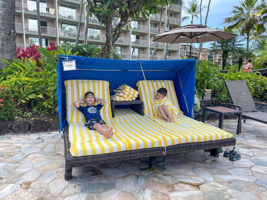 Image of two boys in a cabana at the Royal Sonesta Kauai. Photo credit: Marcie Cheung of Marcie in Mommyland