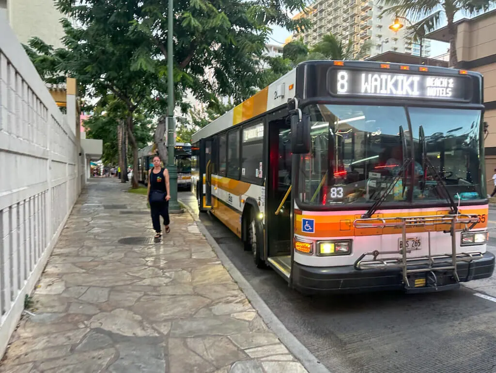 Image of a Honolulu city bus in Waikiki. Photo credit: Marcie Cheung of Marcie in Mommyland