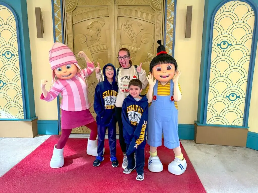 Image of two of the Despicable Me girls with Marcie Cheung and her boys at Universal Studios Florida. Photo credit: Darren Cheung