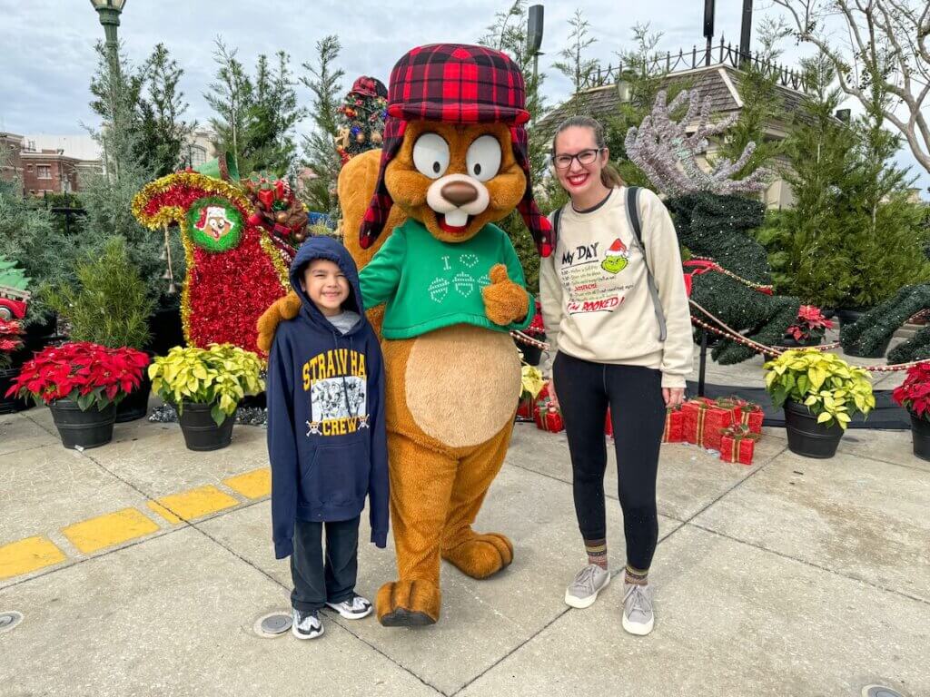 Image of Marcie Cheung and her son with Earl the Squirrel at Universal Orlando.