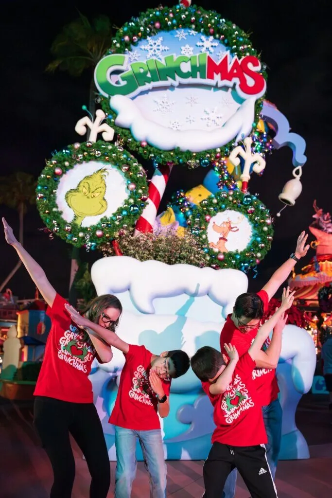 Image of Marcie Cheung and her family celebrating Grinchmas at Universal's Islands of Adventure in Florida. Photo credit: Sees the Day Photography