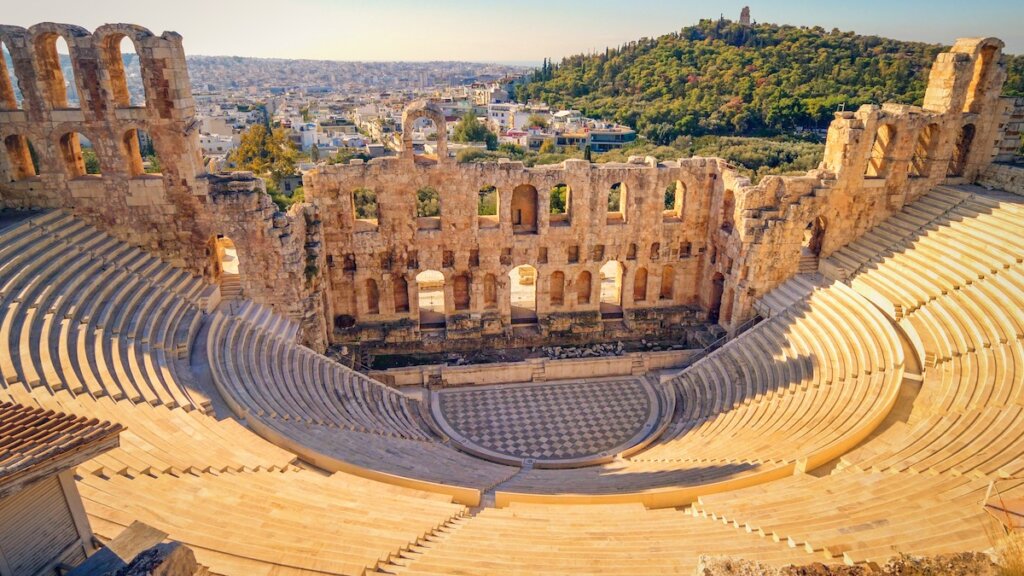 Image of Theatre of Dionysus below the Acropolis in Athens, Greece is considered to be the worlds first theater aka Odeon of Herodes Atticus