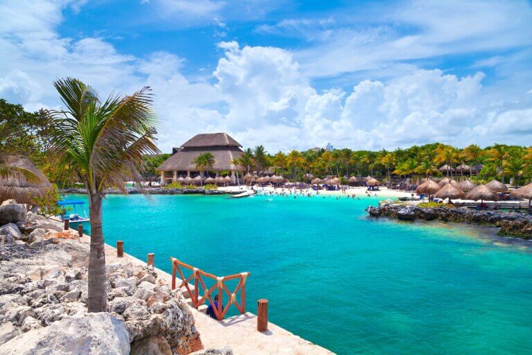 Check out the best things to do in Riviera Maya for families recommended by top family travel blog Marcie in Mommyland. Image of Xcaret Beach in the Mayan Riviera, Mexico