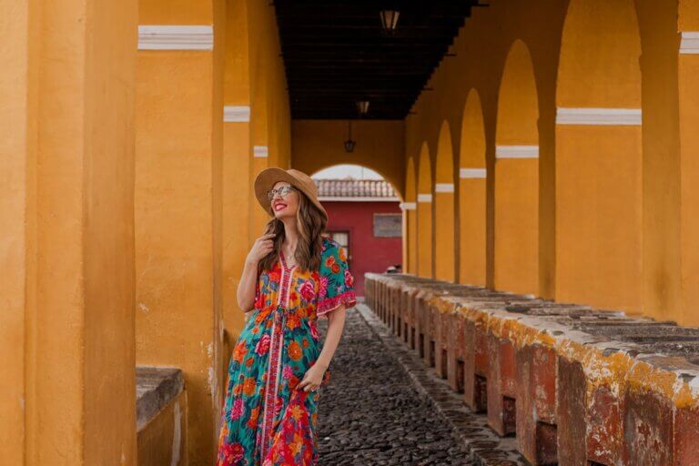Find out the best Guatemala travel tips by top travel blog Marcie in Mommyland. Image of Marcie Cheung walking in Antigua Guatemala