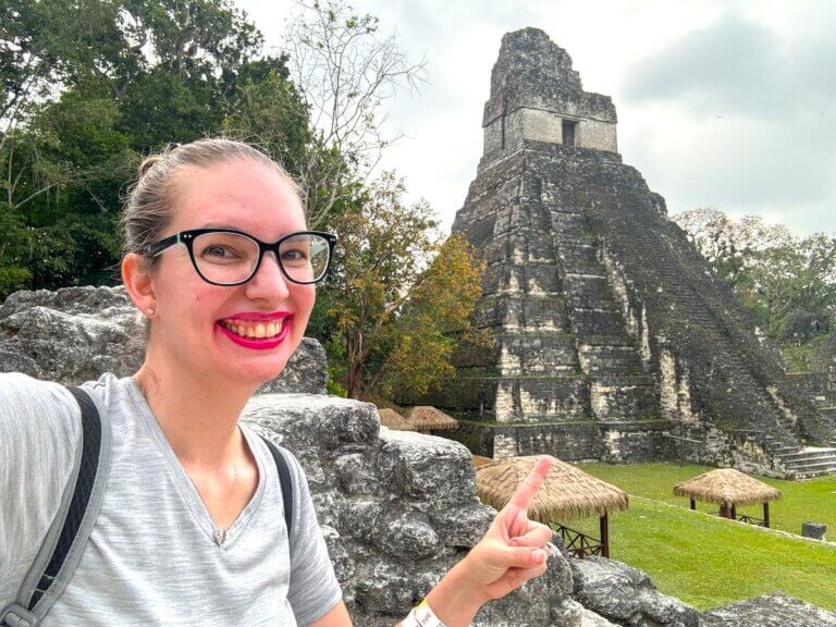 Check out the best places to visit in Guatemala recommended by top family travel blog Marcie in Mommyland. Image of Marcie Cheung at Tikal National Park in Guatemala.