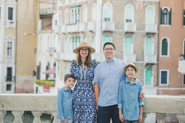 Find out the biggest travel mistakes families make according to top family travel blog Marcie in Mommyland. Image of Marcie Cheung and her family in Veice, Italy
