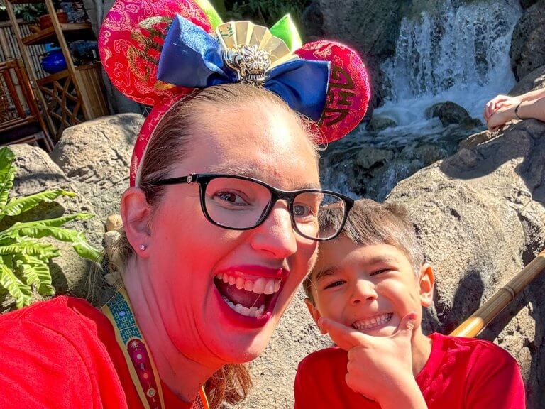 Find out how to save money at Disneyland with tips from top Disney blog Marcie in Mommyland. Image of Marcie Cheung and her son at Disneyland
