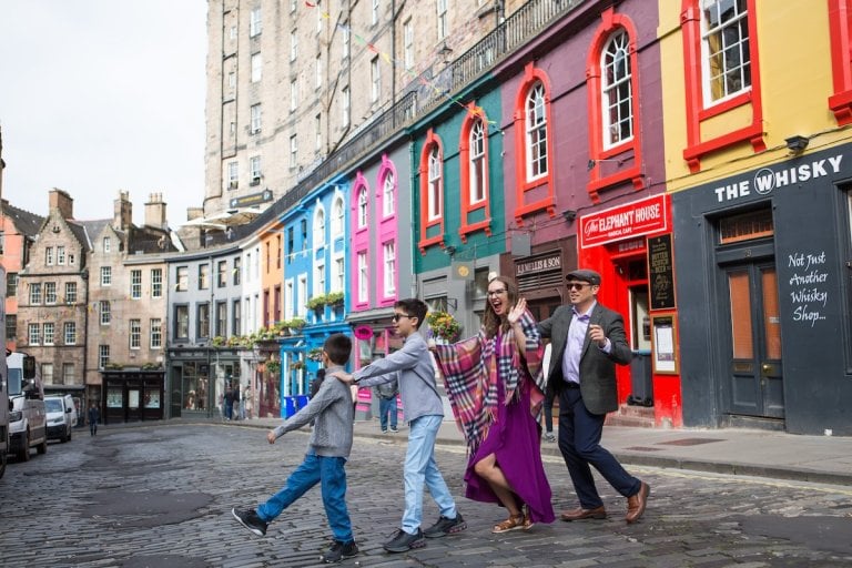 Find out how to book an affordable Edinburgh photo shoot with tips by to family travel blog Marcie in Mommyland. Image of Marcie Cheung and her family in Edinburgh
