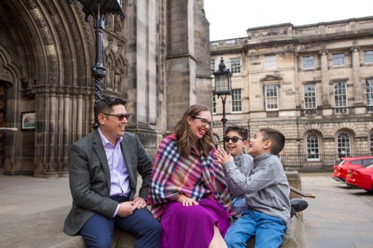 Find out the best Scotland travel tips from top family travel blog Marcie in Mommyland. Image of Marcie Cheung and her family in Edinburgh