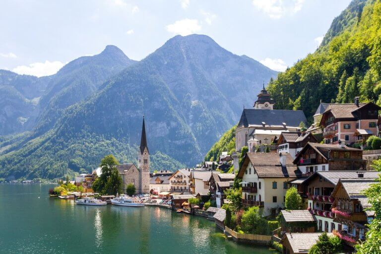 Check out this list of secret Europe summer destinations by top family travel blog Marcie in Mommyland. Image of Hallstatt, Austria.