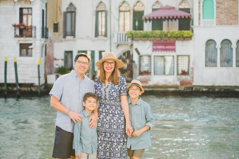 Find out how to survive Italian summers with kids with tips from top family travel blog Marcie in Mommyland. Image of Marcie Cheung and her family in Venice