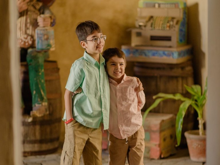 Find out the Cabo secrets every parent should know with tips from top family travel blog Marcie in Mommyland. Image of two boys in Cabo San Lucas