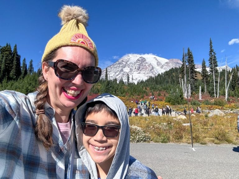 Check out this comparison of Mount Rainier National Park vs Olympic National Park by top Seattle blogger Marcie in Mommyland. Image of Marcie Cheung and her son at Mount Rainier