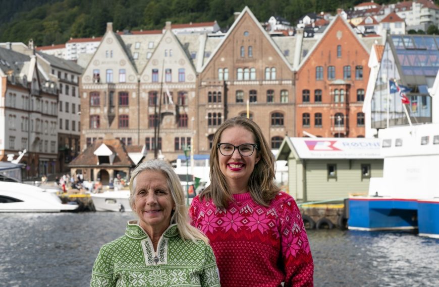 Find out how to spend 3 days in Bergen Norway with tips from top travel blogger Marcie in Mommyland. Image of Marcie Cheung in front of Bryggen.