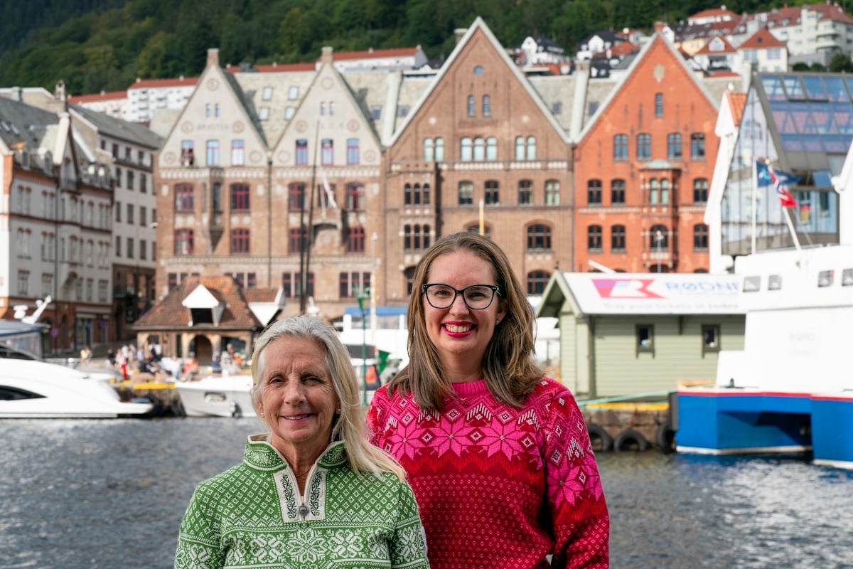 Find out how to spend 3 days in Bergen Norway with tips from top travel blogger Marcie in Mommyland. Image of Marcie Cheung in front of Bryggen.