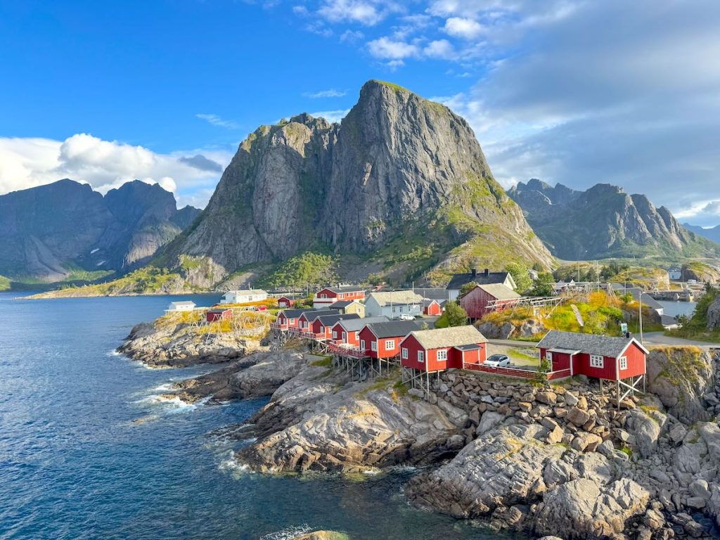 Find out how to plan a trip to the Lofoten Islands in Norway with tips from top travel blogger Marcie in Mommyland. Image of a fishing village