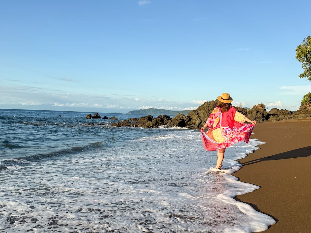 Check out this review of La Paloma Lodge on the Osa Peninsula in Costa Rica by top travel blogger Marcie Cheung. Image of Marcie Cheung on the beach