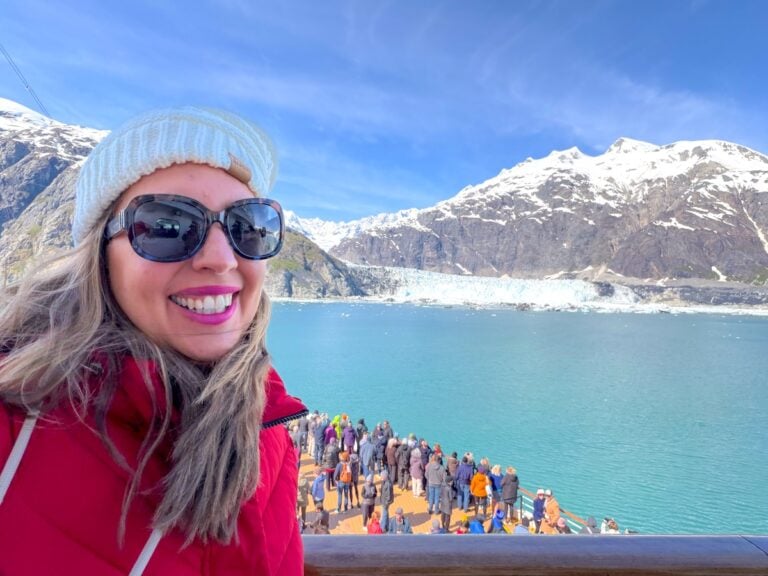 Image of Marcie Cheung on a cruise ship in Alaska in front of a glacier