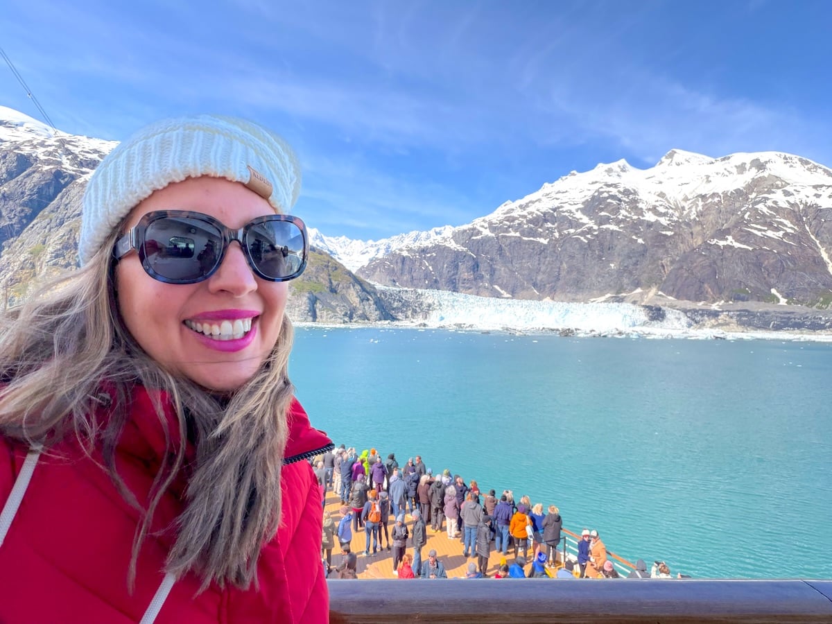Image of Marcie Cheung on a cruise ship in Alaska in front of a glacier