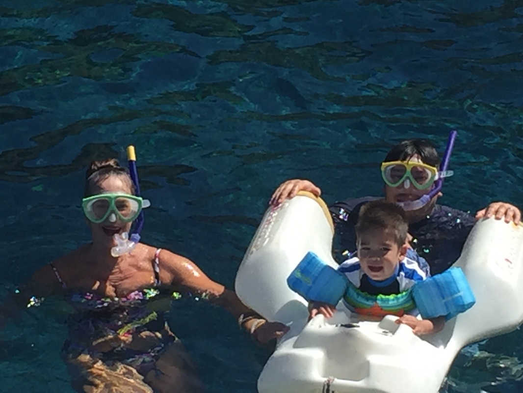 Owen Darren and Grandma snorkeling on the Four Winds Maui