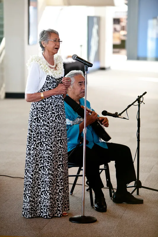 Photo of Hawaiian musicians playing the Hawaiian Wedding Song at our travel themed wedding in Seattle. #hawaiianwedding #travelthemedwedding #diywedding